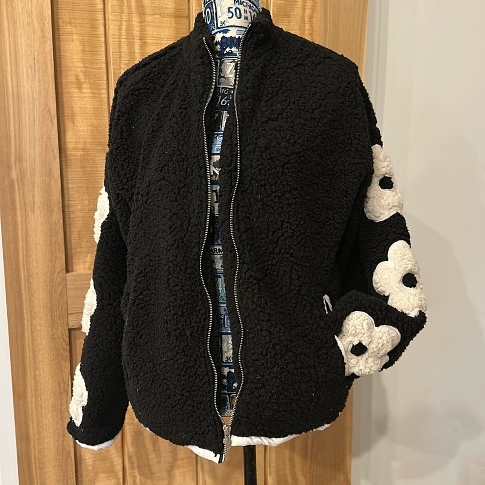 Fleece jacket with floral sleeves